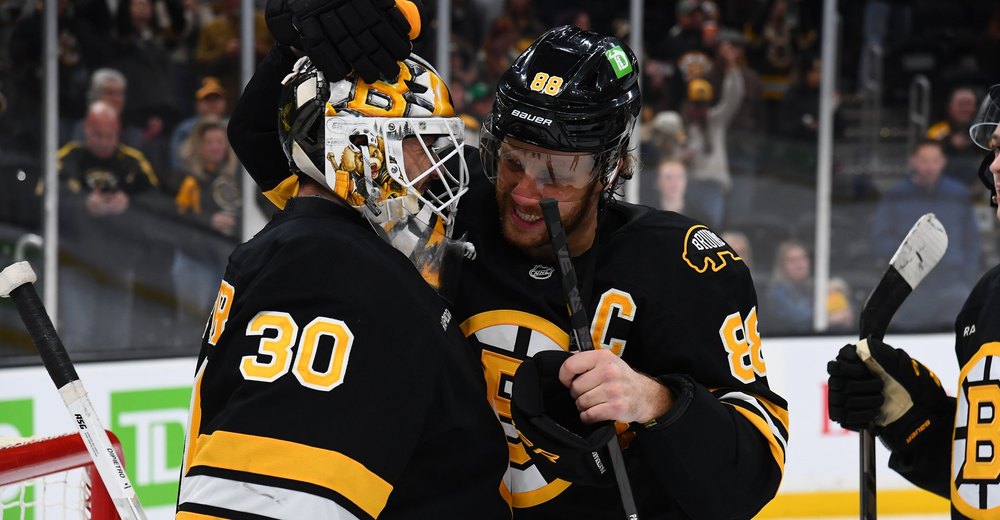 David Pastrnak hugs Michael DiPietro after DiPietro's first NHL shutout, a 6-0 win over Nashville at TD Garden